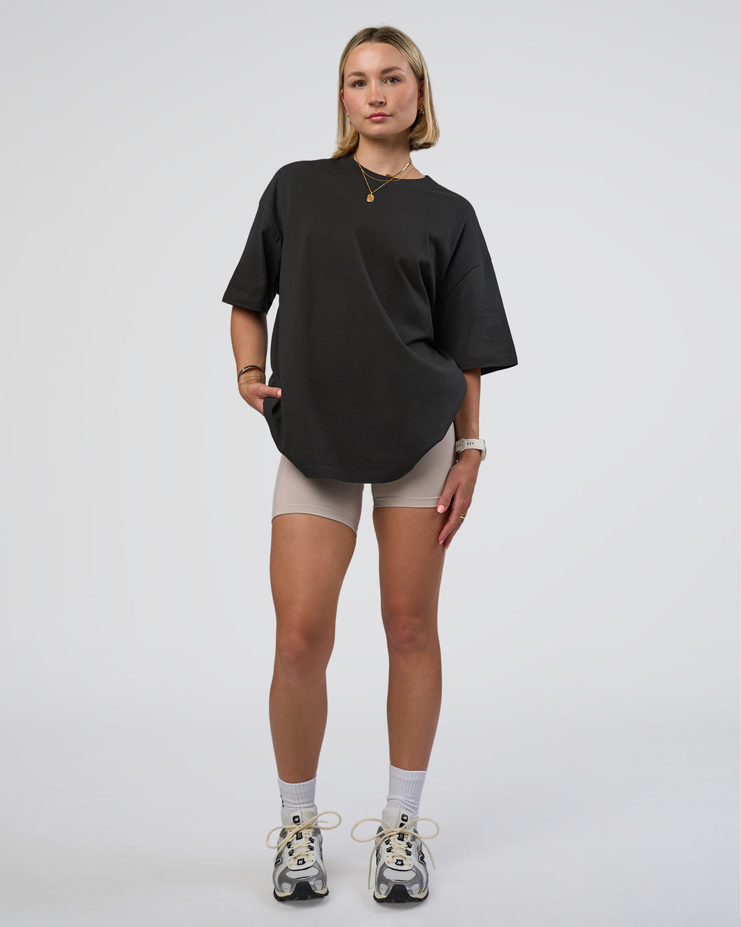 Woman wearing Spray Heavyweight Unisex Oversized Tee - Charcoal Washed | Model:Halle | Size:XS