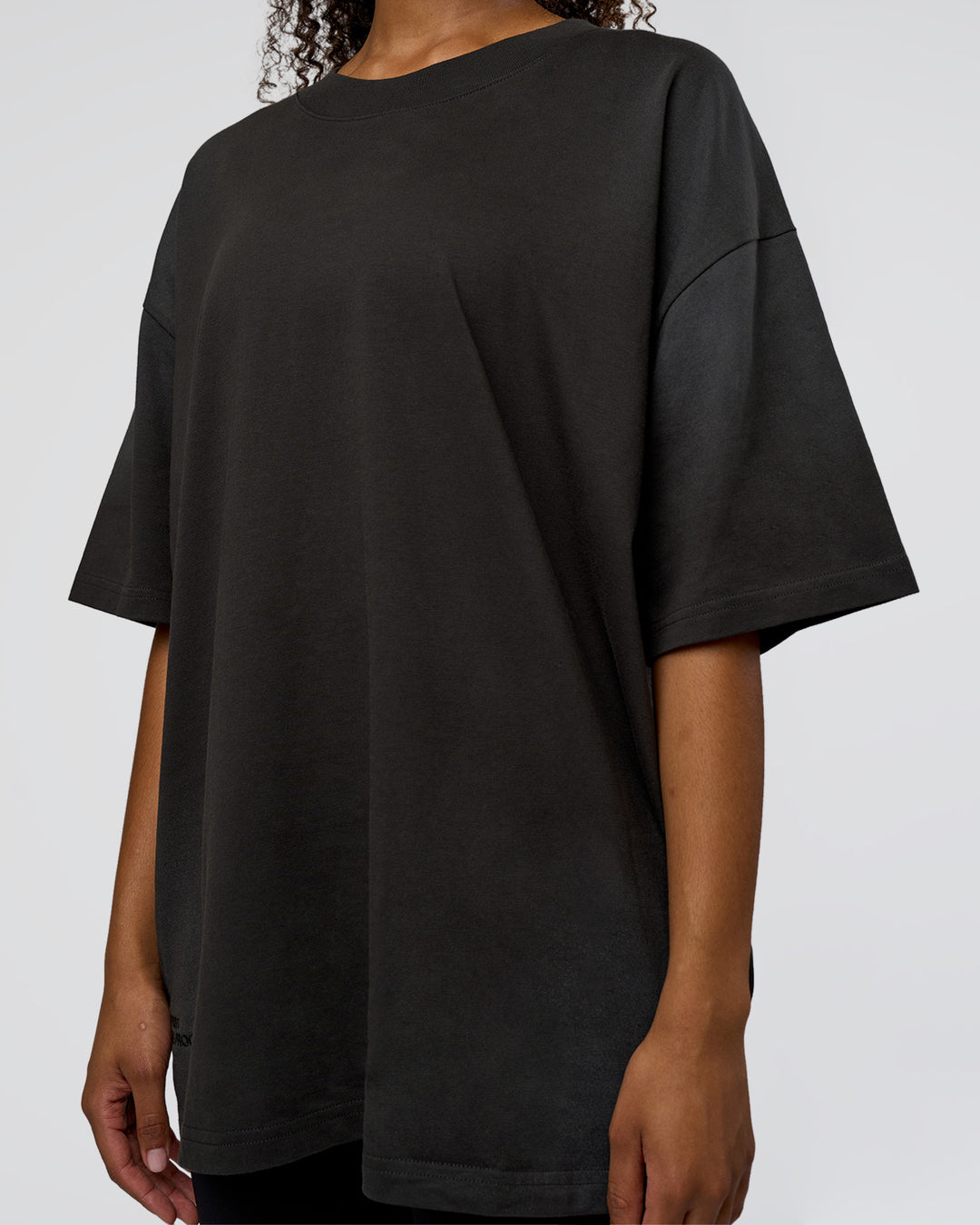 Woman wearing Spray Heavyweight Unisex Oversized Tee - Charcoal Washed | Model:Jordan | Size:S