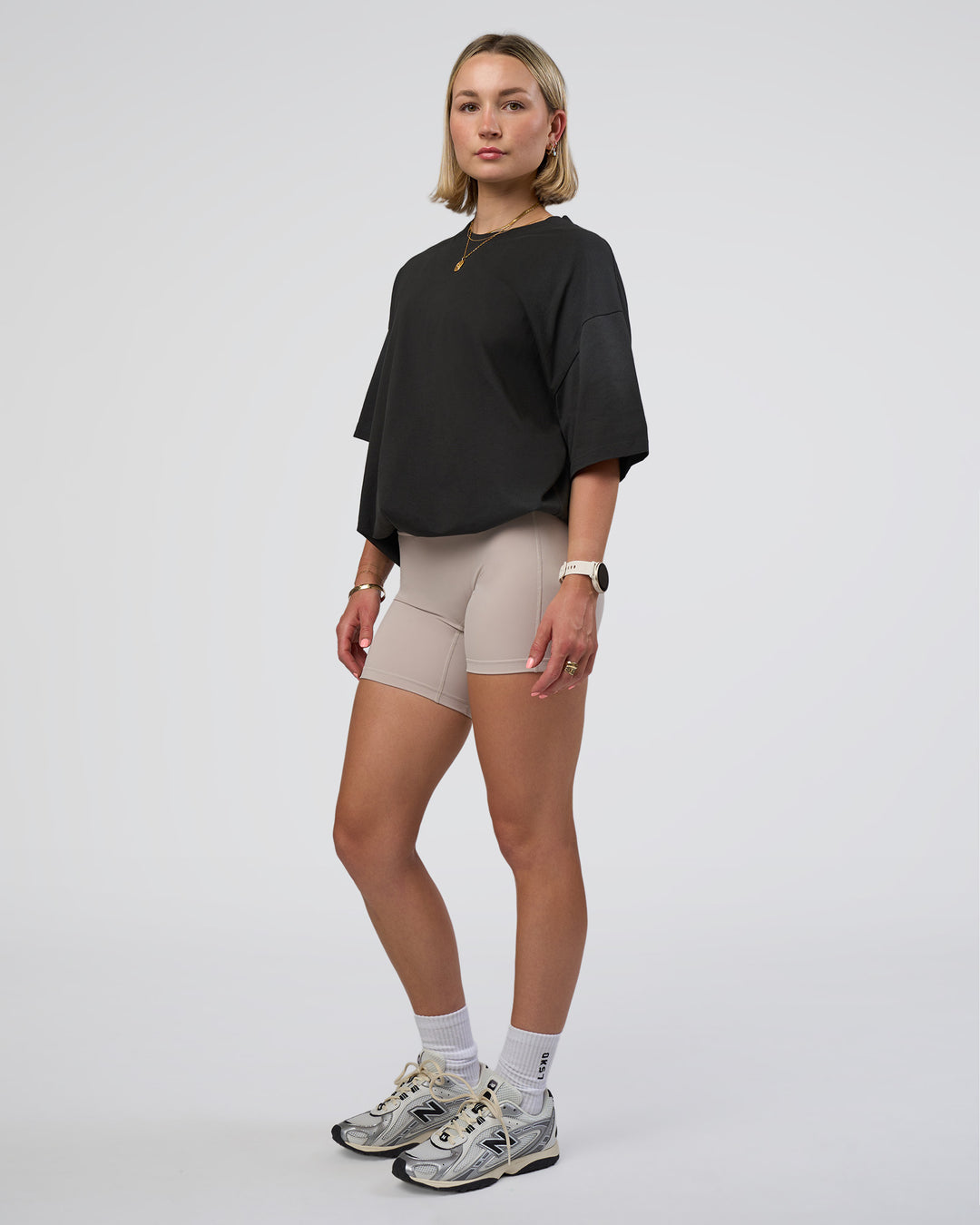Woman wearing Spray Heavyweight Unisex Oversized Tee - Charcoal Washed | Model:Halle | Size:XS