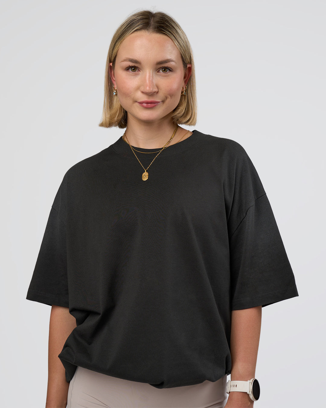 Woman wearing Spray Heavyweight Unisex Oversized Tee - Charcoal Washed | Model:Halle | Size:XS