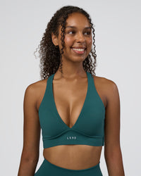 Woman wearing Stamina Sports Bra D/DD/E - Transformative Teal | Model:Jordan | Size:XS