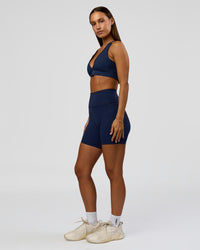 Woman wearing Stamina Sports Bra - Future Navy | Model:Brylee | Size:XS | Thumbnail Index: 4