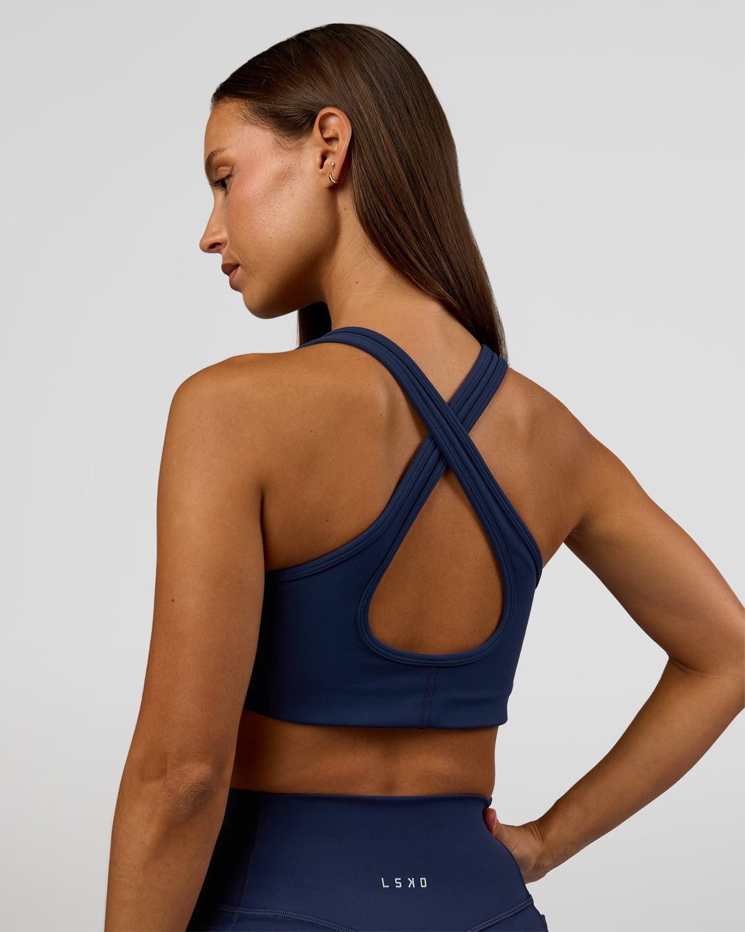 Woman wearing Stamina Sports Bra - Future Navy | Model:Brylee | Size:XS - view 3