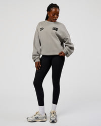 Woman wearing Static Grit Boxy Crew - Alloy-Black | Model:Ellie | Size:XS