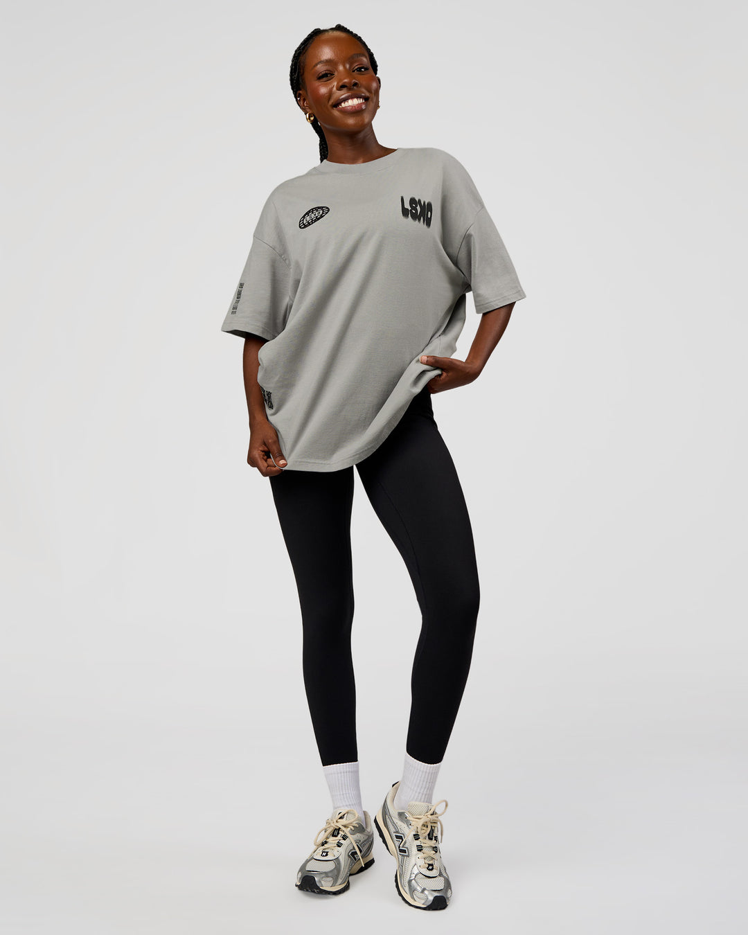 Woman wearing Static Grit Heavyweight Oversized Tee - Alloy-Black | Model:Ellie | Size:XS