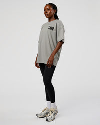 Woman wearing Static Grit Heavyweight Oversized Tee - Alloy-Black | Model:Ellie | Size:XS