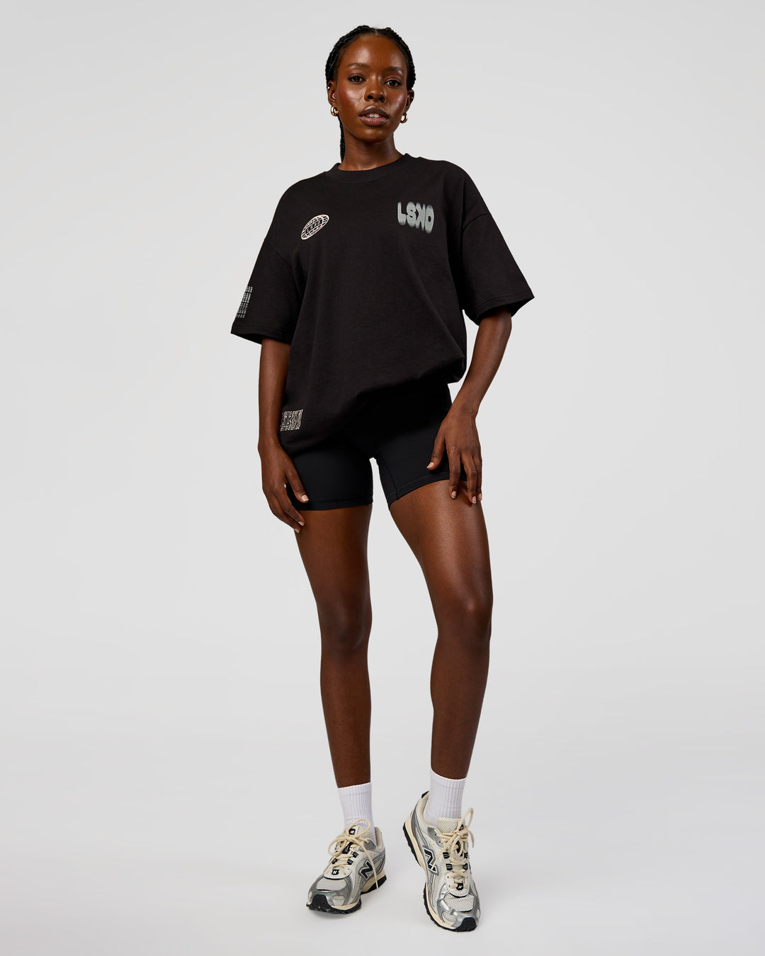 Woman wearing Static Grit Heavyweight Oversized Tee - Black-Alloy | Model:Ellie | Size:XS