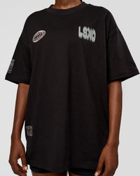 Woman wearing Static Grit Heavyweight Oversized Tee - Black-Alloy | Model:Ellie | Size:XS