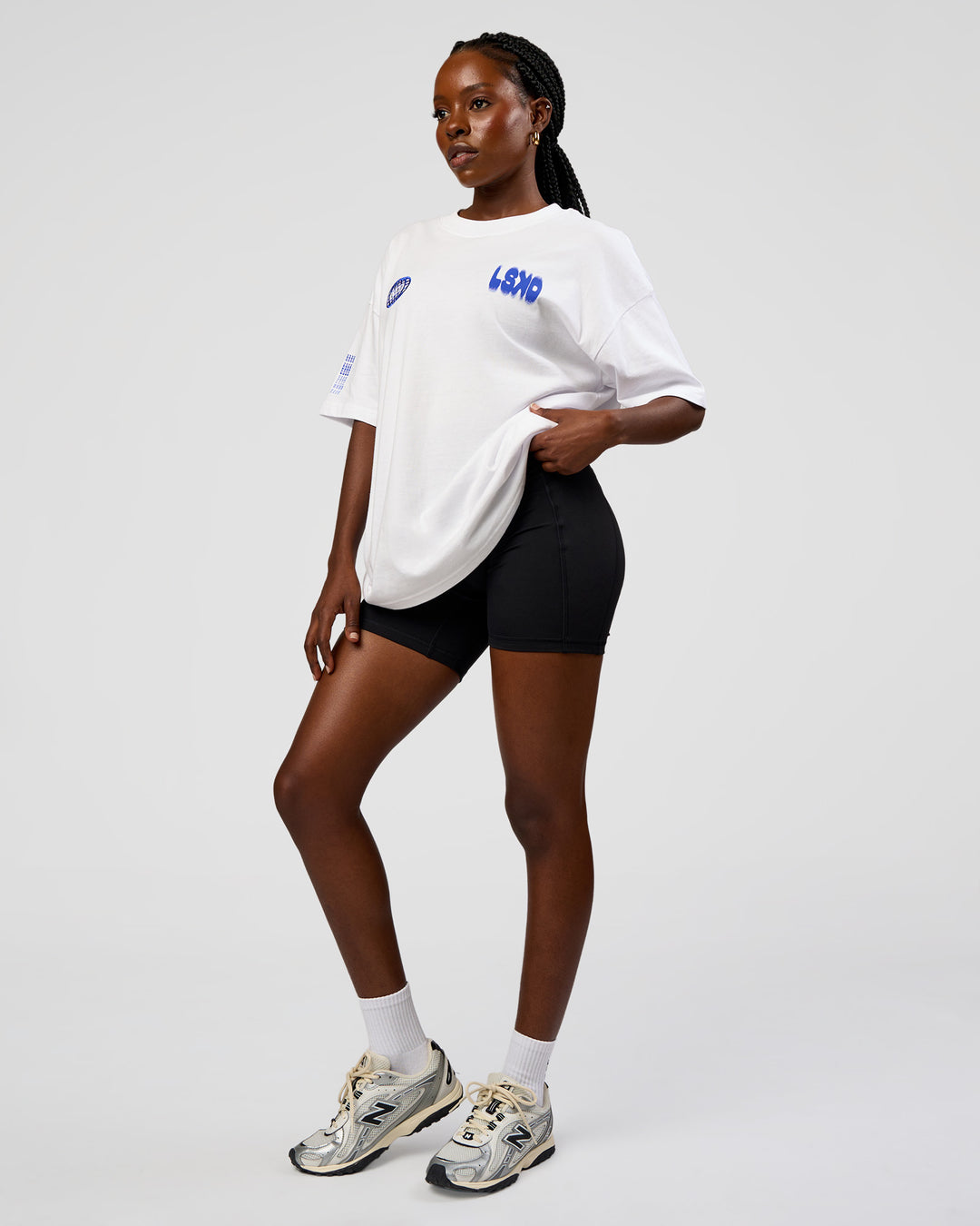 Woman wearing Static Grit Heavyweight Oversized Tee - White-Electric Indigo | Model:Ellie | Size:XS