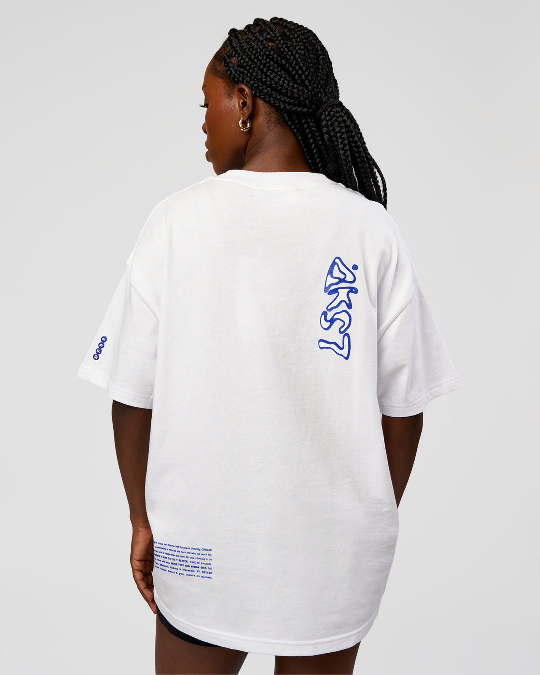 Woman wearing Static Grit Heavyweight Oversized Tee - White-Electric Indigo | Model:Ellie | Size:XS