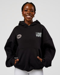 Woman wearing Static Grit Unisex Boxy Hoodie - Black-Alloy | Model:Ellie | Size:XS
