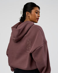 Woman wearing Static Grit Unisex Boxy Hoodie - Cocoa Powder-Hot Chocolate | Model:Loren | Size:XS