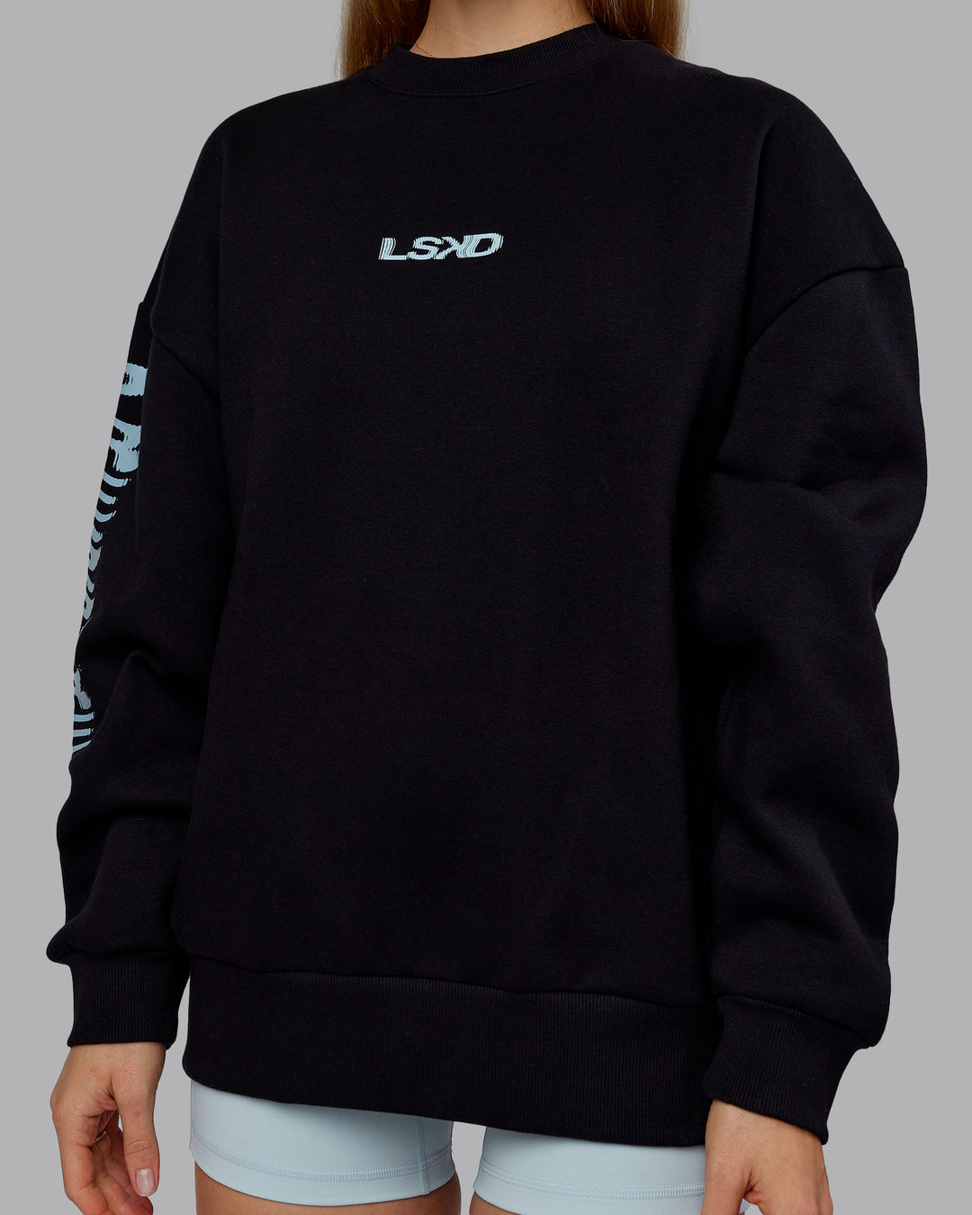 Woman wearing Static Oversized Sweater - Black-Skyride | Model:Emilie | Size:XS