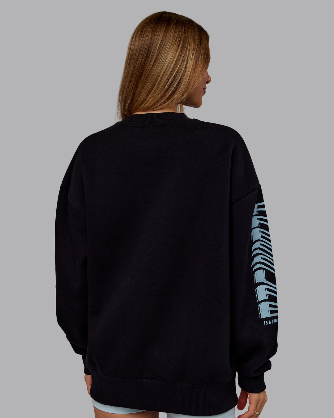 Woman wearing Static Oversized Sweater - Black-Skyride | Model:Emilie | Size:XS