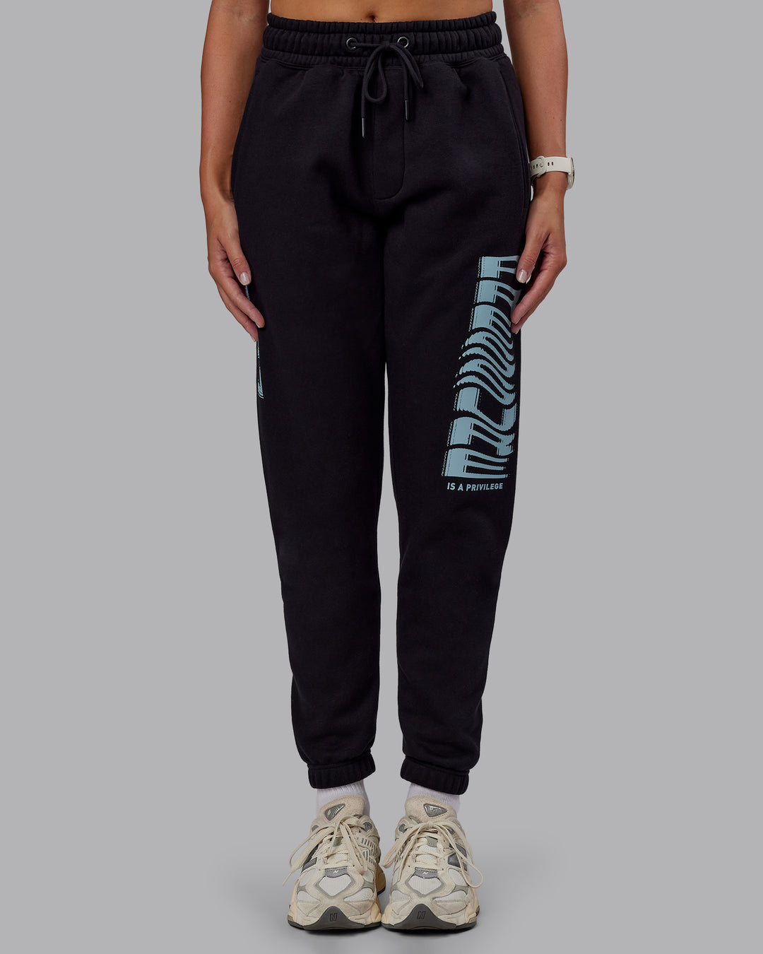 Woman wearing Static Track Pant - Black-Skyride | Model:Phoebe | Size:XS