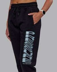 Woman wearing Static Track Pant - Black-Skyride | Model:Phoebe | Size:XS