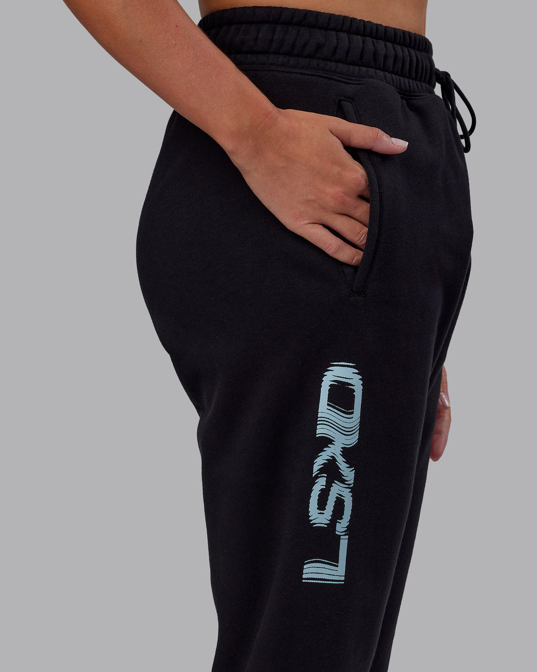Woman wearing Static Track Pant - Black-Skyride | Model:Phoebe | Size:XS