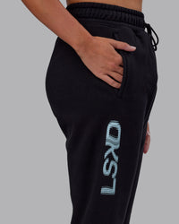 Woman wearing Static Track Pant - Black-Skyride | Model:Phoebe | Size:XS