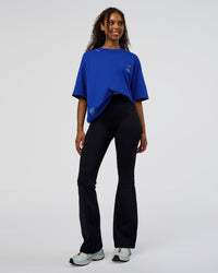 Woman wearing Sticker Heavyweight Oversized Tee - Electric Indigo-Baltic Sea | Model:Jordan | Size:XS