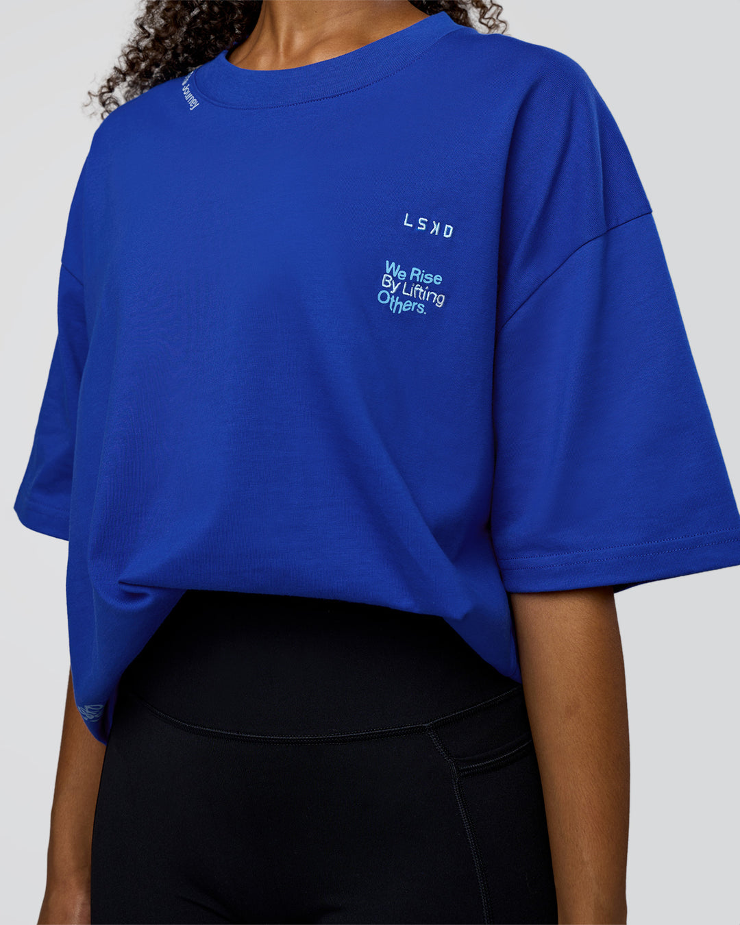 Woman wearing Sticker Heavyweight Oversized Tee - Electric Indigo-Baltic Sea | Model:Jordan | Size:XS