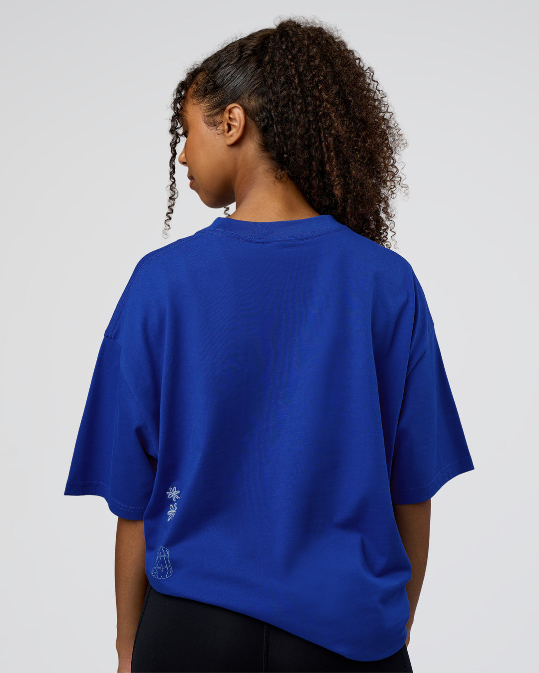 Woman wearing Sticker Heavyweight Oversized Tee - Electric Indigo-Baltic Sea | Model:Jordan | Size:XS