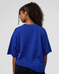 Woman wearing Sticker Heavyweight Oversized Tee - Electric Indigo-Baltic Sea | Model:Jordan | Size:XS