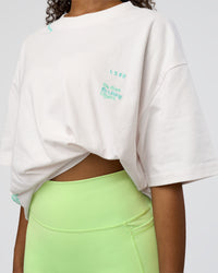 Woman wearing Sticker Heavyweight Oversized Tee - Off White-Jelly Mint | Model:Jordan | Size:XS