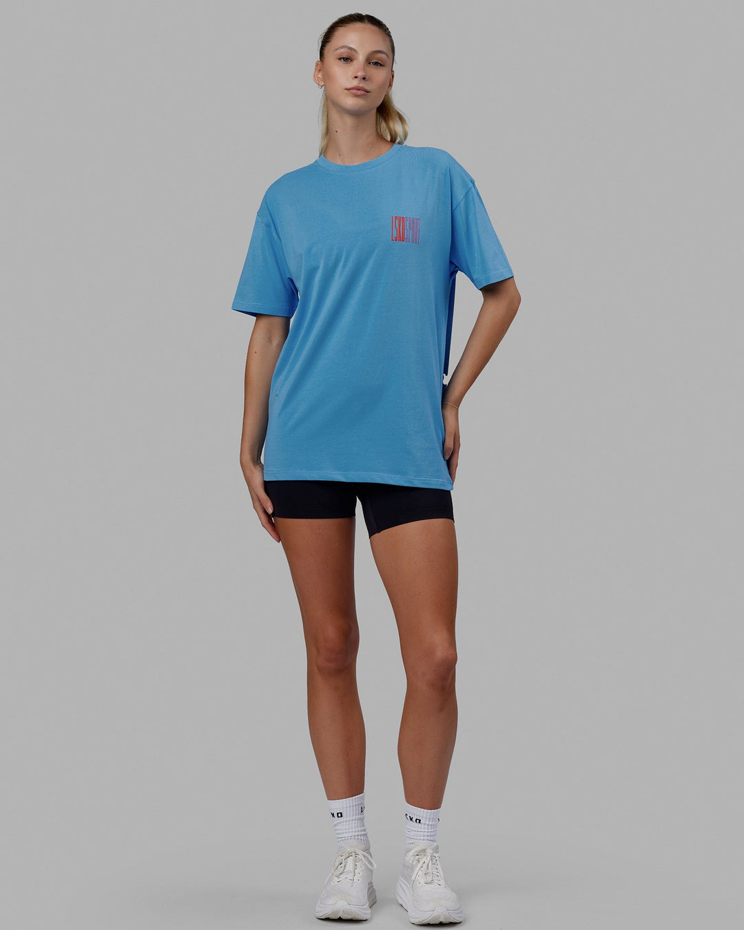 Woman wearing Unisex Stretch It FLXCotton Tee Oversize - Azure Blue