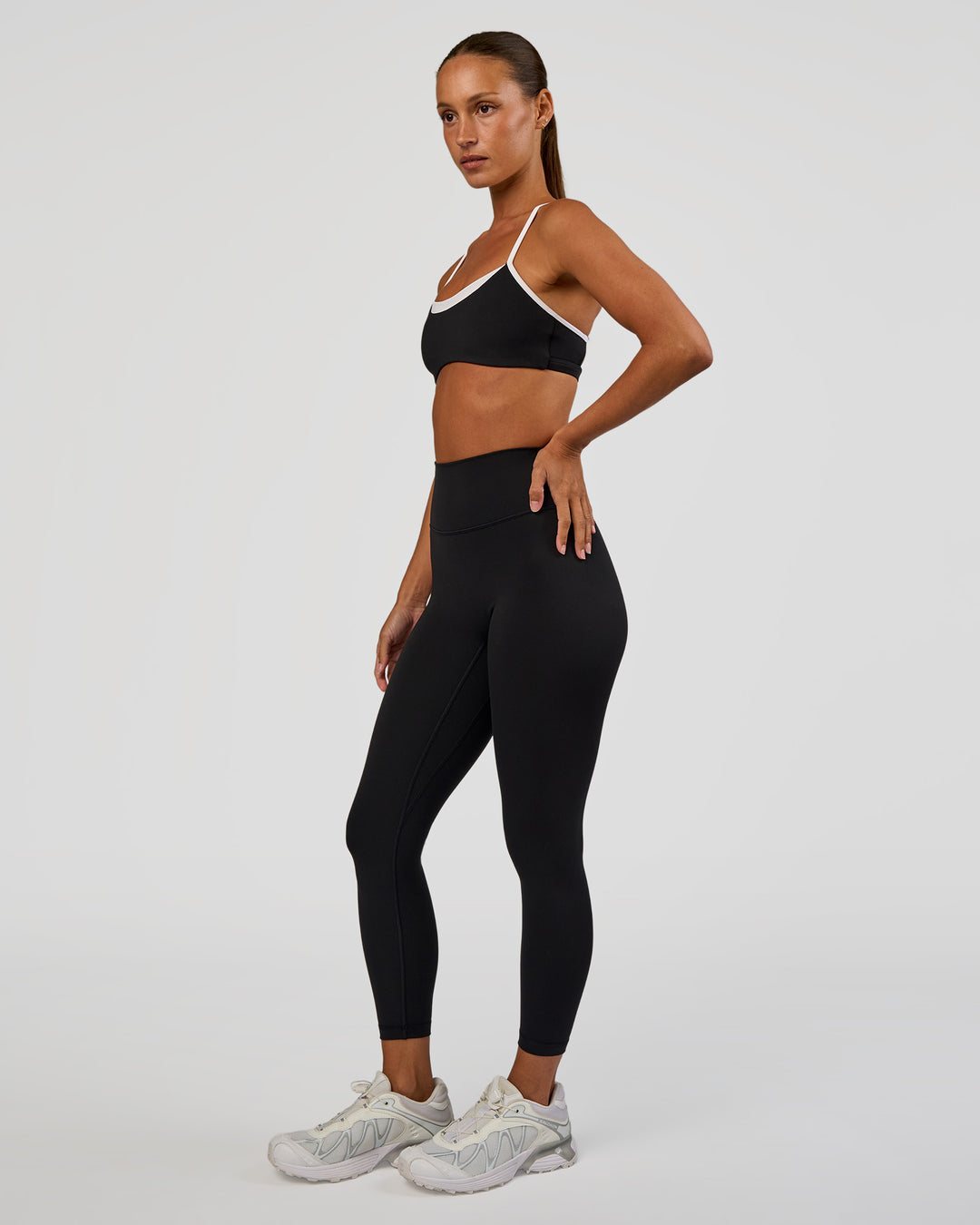 Woman wearing Tempo Sports Bra - Black-White | Model:Brylee | Size:XS