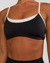 Woman wearing Tempo Sports Bra - Black-White | Model:Brylee | Size:XS