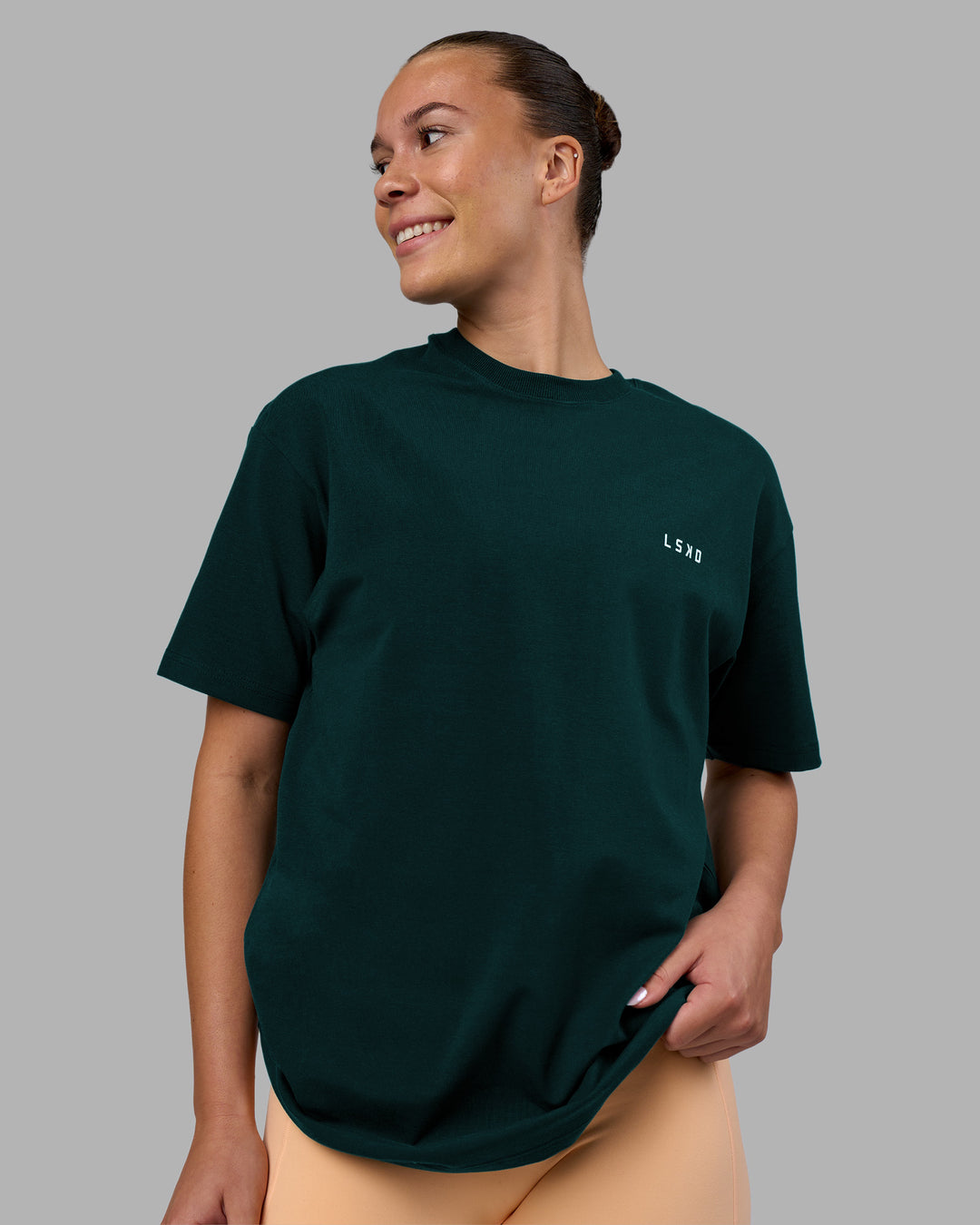 Woman wearing Think Strong Heavyweight FLXCotton Tee Oversize - Dark Moss-Off White | Model:Charlize | Size:XS