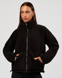 Woman wearing Thrive Reversible Jacket - Black | Model:Brylee | Size:XS