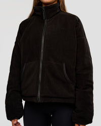 Woman wearing Thrive Reversible Jacket - Black | Model:Brylee | Size:XS
