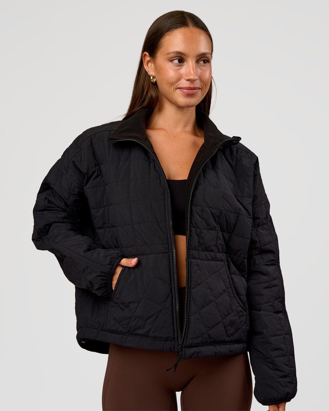 Woman wearing Thrive Reversible Jacket - Black | Model:Brylee | Size:XS