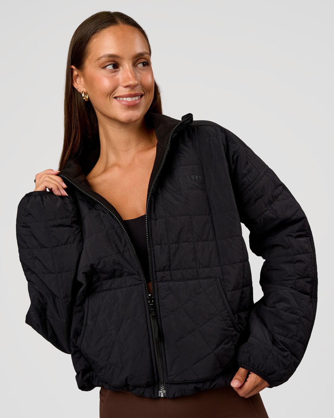Woman wearing Thrive Reversible Jacket - Black | Model:Brylee | Size:XS