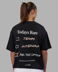 Woman wearing Today's Run FLXCotton Oversized Tee - Black-White | Model:Charlize | Size:XS