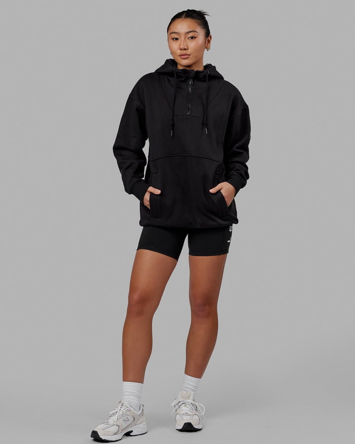 Woman wearing Unisex Trek Hoodie Oversize - Black