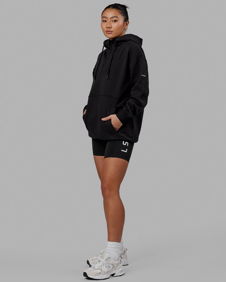 Woman wearing Unisex Trek Hoodie Oversize - Black