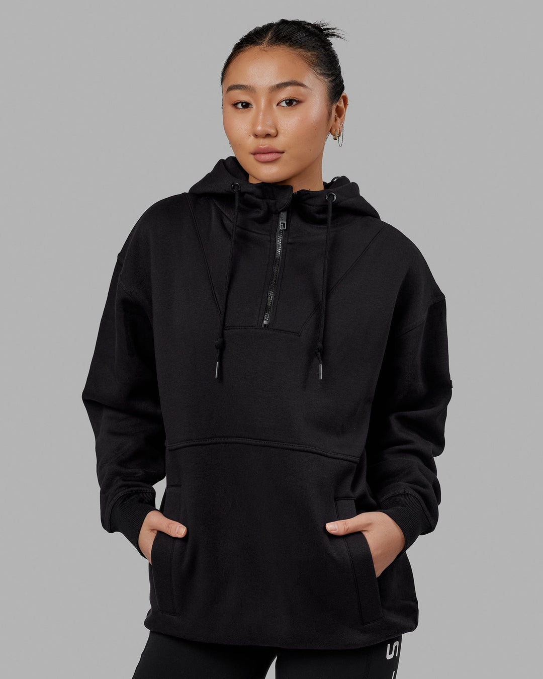 Woman wearing Unisex Trek Hoodie Oversize - Black