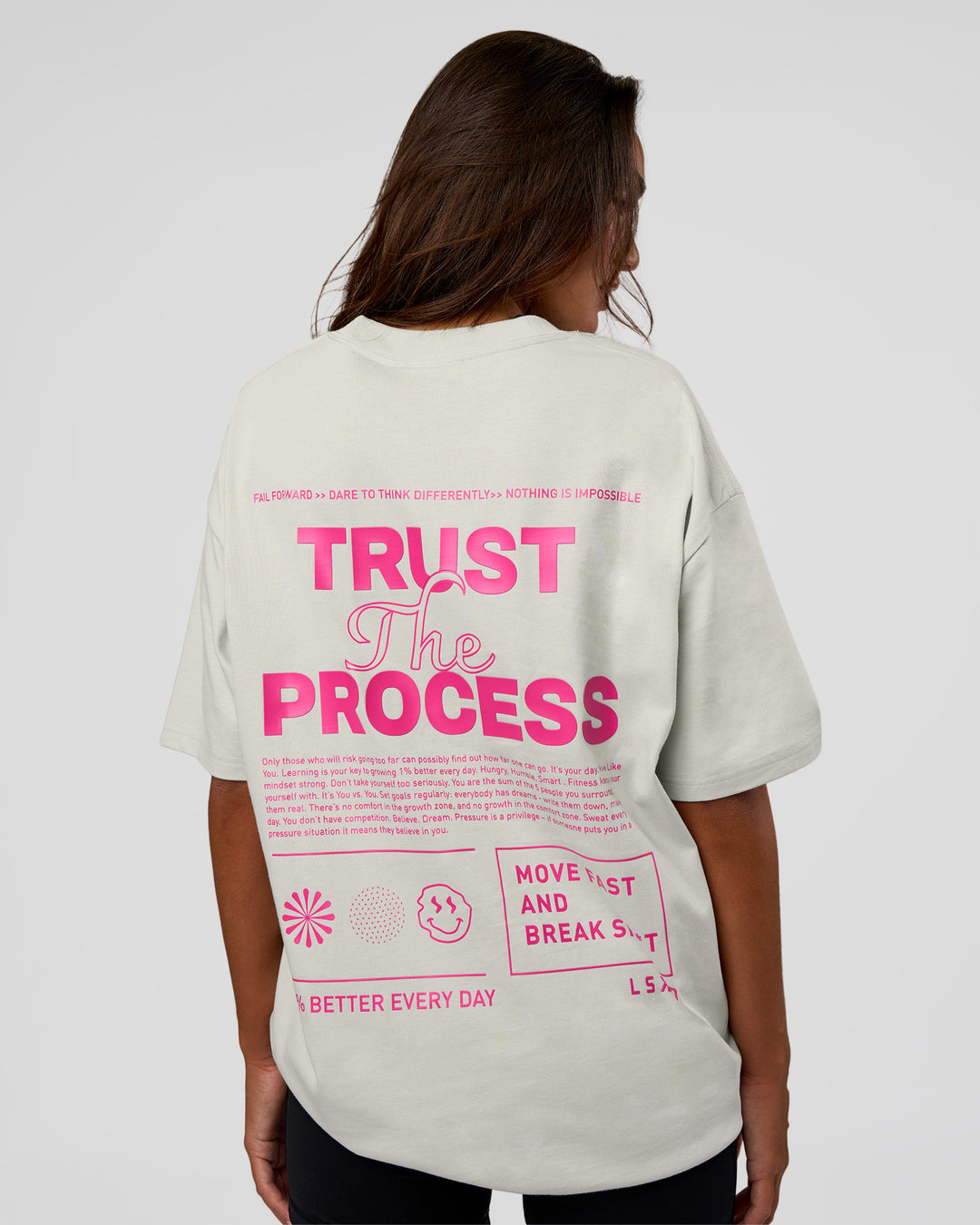 Woman wearing Trust The Process Heavyweight Unisex Oversized Tee - Digital Mist-Ultra Pink | Model:Kirstyn | Size:XS
