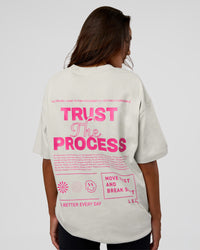 Woman wearing Trust The Process Heavyweight Unisex Oversized Tee - Digital Mist-Ultra Pink | Model:Kirstyn | Size:XS
