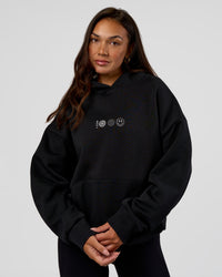 Woman wearing Trust The Process Unisex Oversized Hoodie - Black-White | Model:Kirstyn | Size:XS