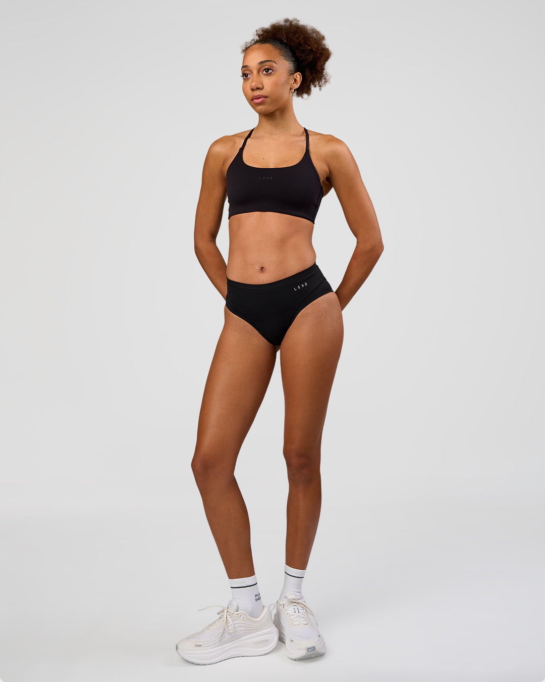 Woman wearing Turbo Track Brief in Black | Model:Txai | Size:XS