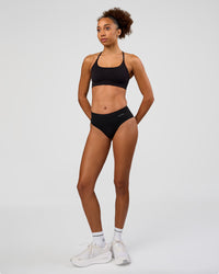 Woman wearing Turbo Track Brief in Black | Model:Txai | Size:XS