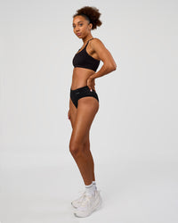 Woman wearing Turbo Track Brief in Black | Model:Txai | Size:XS