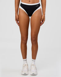 Woman wearing Turbo Track Brief in Black-White| Model:Txai | Size:XS