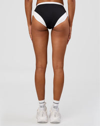 Woman wearing Turbo Track Brief in Black-White| Model:Txai | Size:XS