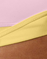 Woman wearing Turbo Track Brief in Marshmallow-Lemon | Model:Txai | Size:XS