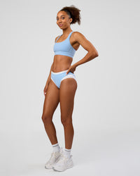 Woman wearing Turbo Track Brief in Open Air-White | Model:Txai | Size:XS | Thumbnail Index: 4