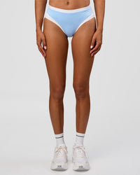 Woman wearing Turbo Track Brief in Open Air-White | Model:Txai | Size:XS | Thumbnail Index: 5